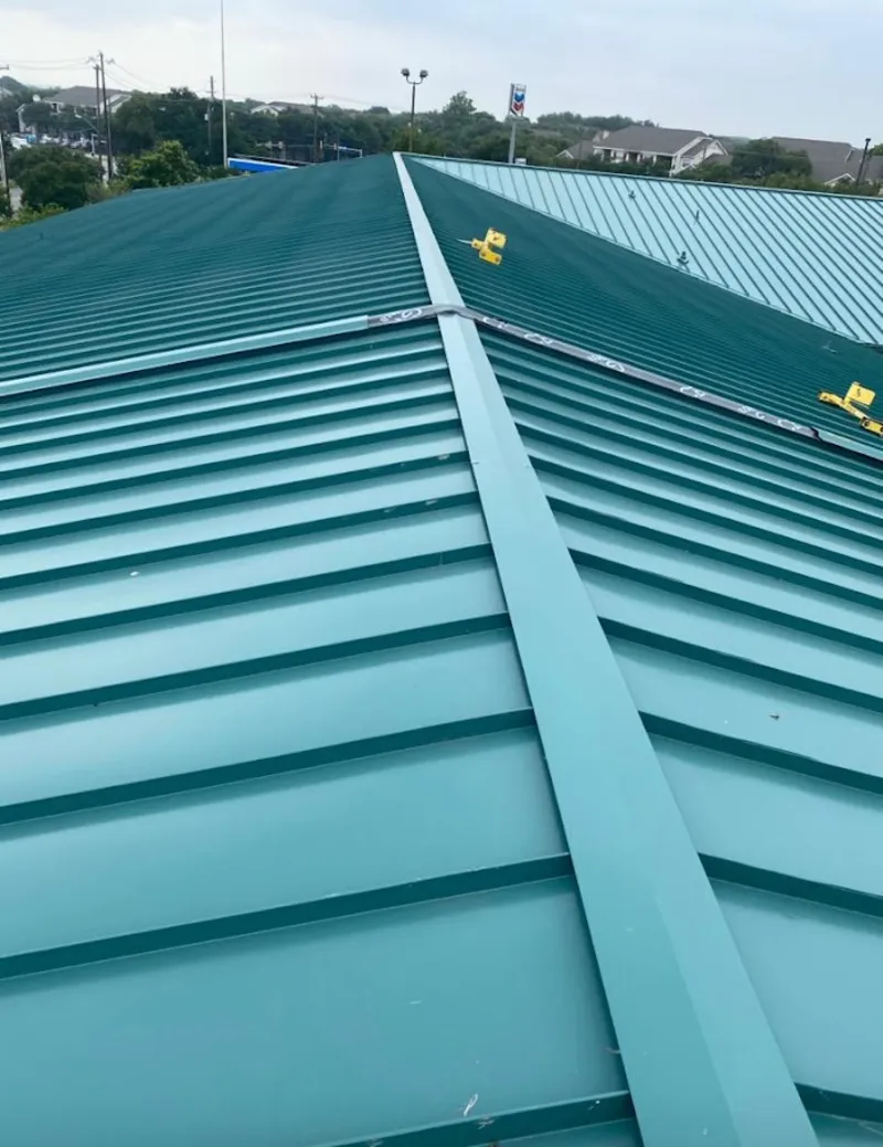 Green commercial metal roof ridge and valley for Metal Roof Repair in Clayton